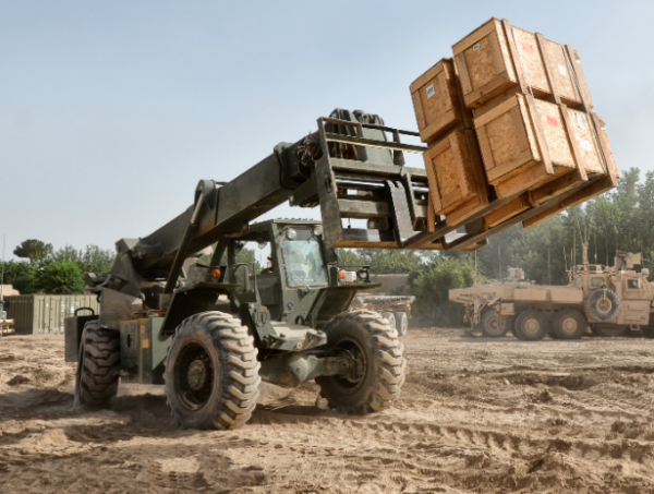 crates are lifted by a tractor