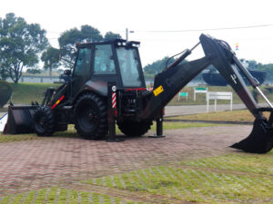 Backhoe loader used in crane and hoisting operations for construction and maintenance work